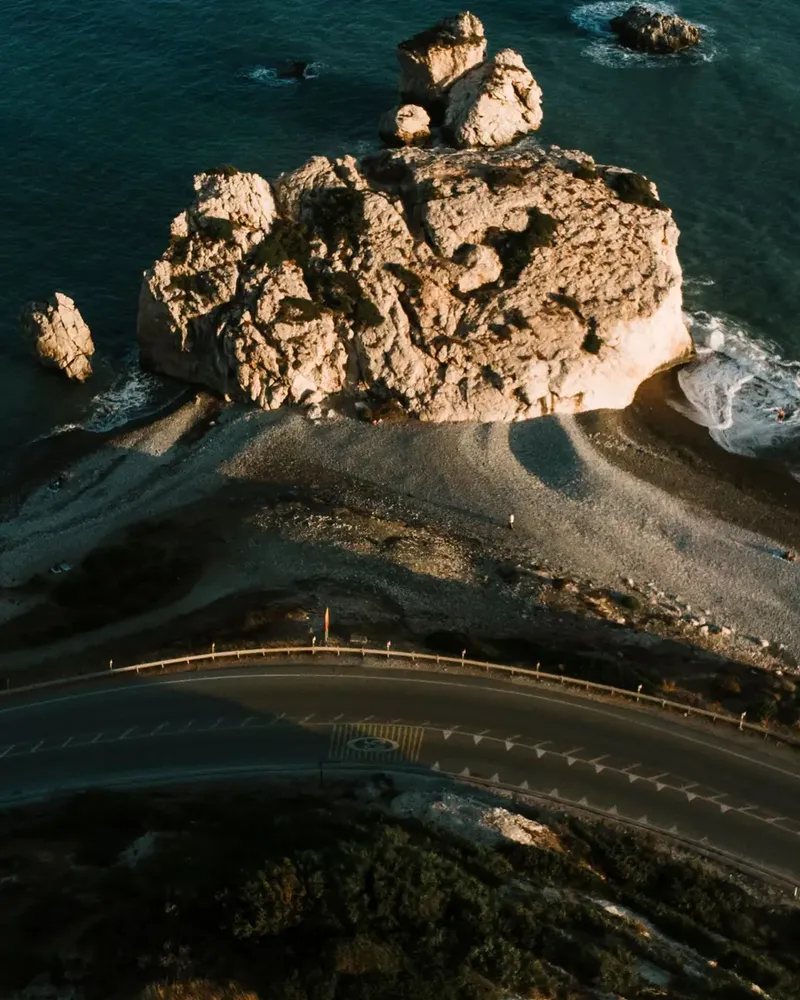 A coast road curving past the sea in Cyprus