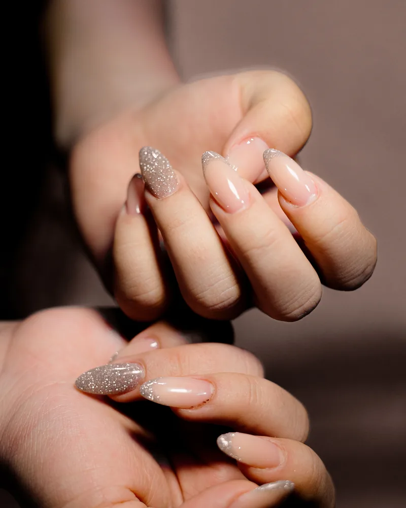 Sample photo: a manicure with nude and glitter nails