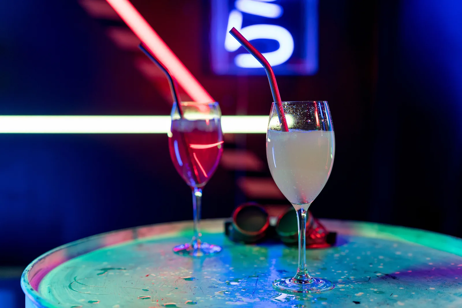 Sample photo: cocktails glowing under neon light