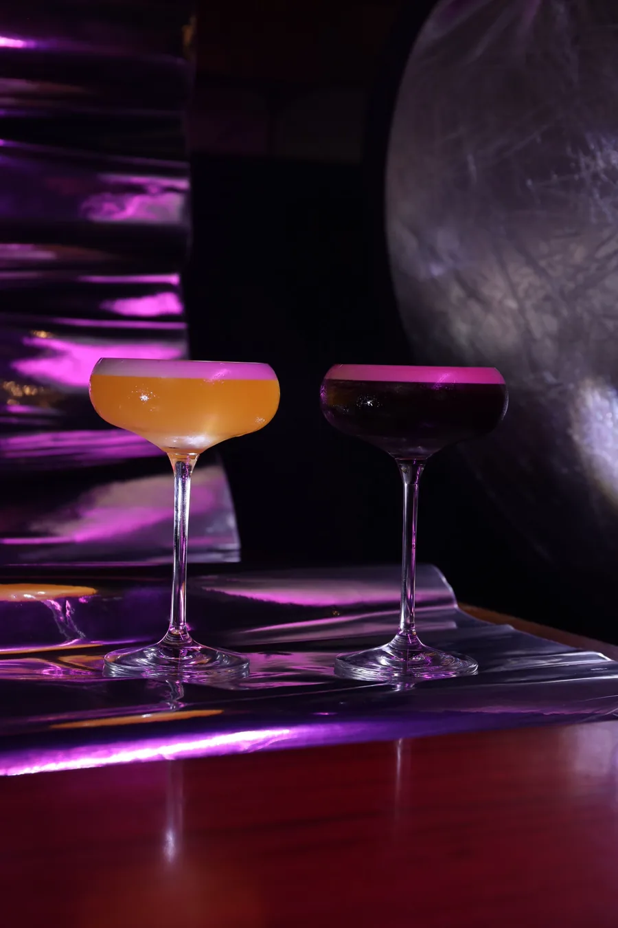 Sample photo: cocktails glowing under purple and neon light