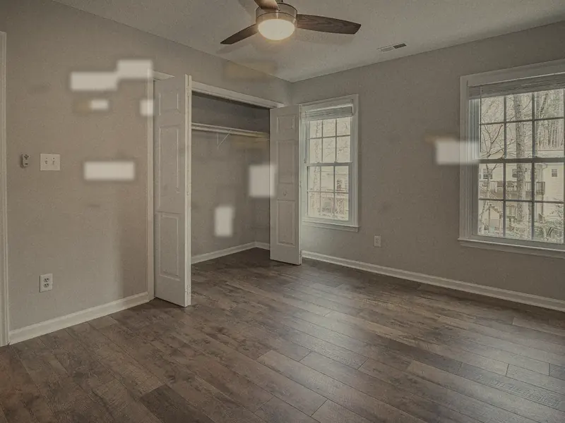 A living room wall before painting, with marks and patches.