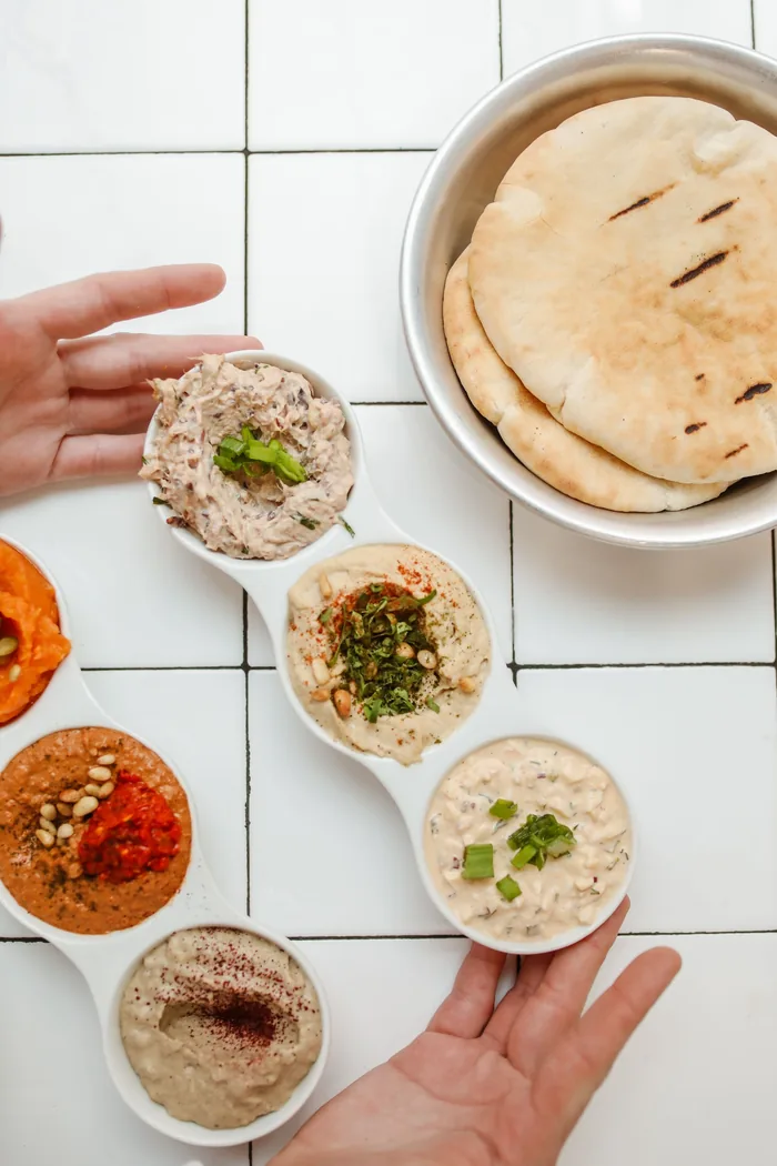Sample photo: pita bread and dips on white tiles